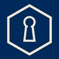 A keyhole design inside a hexagon on a blue background